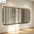 Modern metal display rack for showcasing flip-style art-painted mosaic tiles in a floor showroom