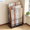 Custom metal display racks for showcasing fabric rolls in showrooms, ensuring high visibility
